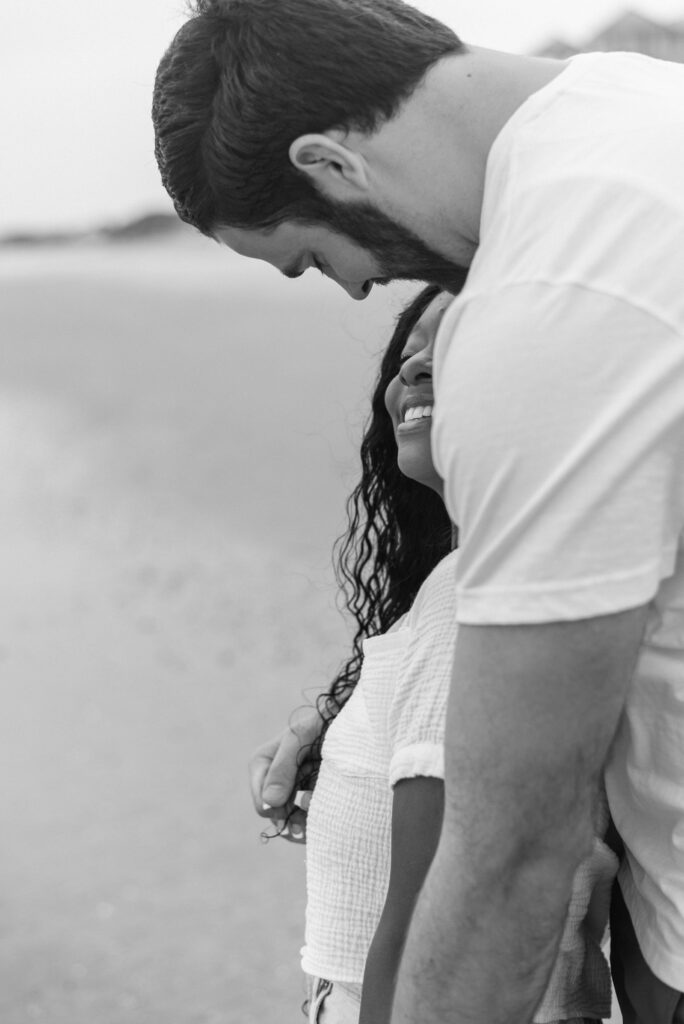 close up black and white image of an engaged couple on isle of palms beach